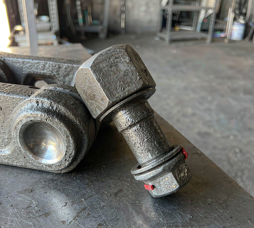 Why excavator track shoe bolts break or keep coming loose